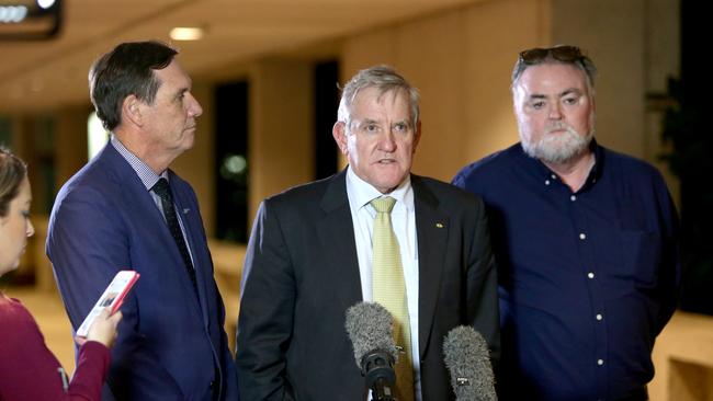 Minister Anthony Lynham, QRC’s Ian Macfarlane and AWU’s Mark Raguse. Picture: AAP Image/Steve Pohlner