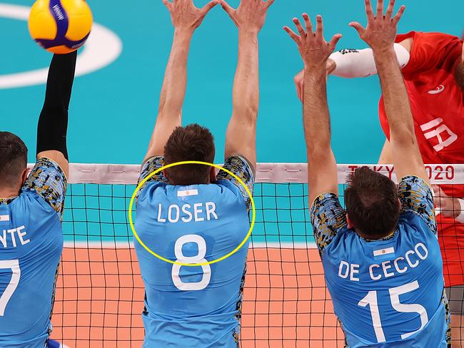 TOKYO, JAPAN - JULY 24: Egor Kliuka #18 of Team ROC hits the ball past the Team Argentina defense during the Men's Preliminary Round - Pool B on day one of the Tokyo 2020 Olympic Games at Ariake Arena on July 24, 2021 in Tokyo, Japan. (Photo by Toru Hanai/Getty Images)