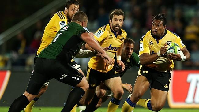 Julian Savea makes a charge for the Hurricanes.