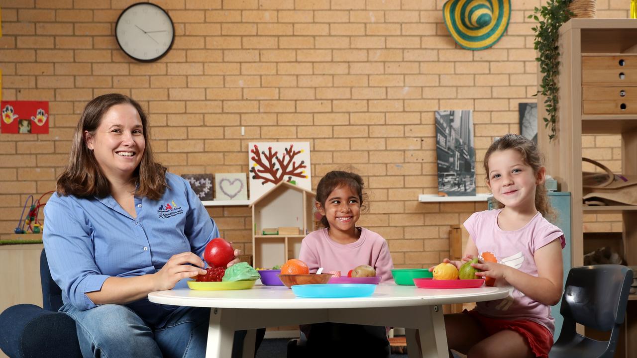 Early childhood teacher Rebecca Gibbs with children from Amber Cottage Early Learning Centre in Ambarvale. Picture: Jonathan Ng