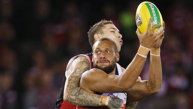 Adelaide's Cam Ellis-Yolmen looks to hand off as he is tackled by St Kilda’s Matthew Parker. Picture: Michael Klein.