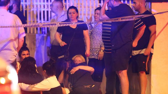 Nabil’s family and friends mourn at the scene where he was killed. Picture: Wayne Taylor