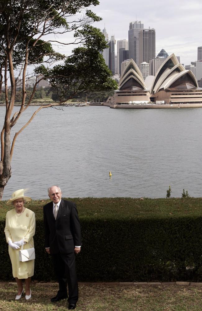 Queen Elizabeth II and Australian Prime Minister John Howard pose for a photograph on the front lawn of Admiralty House after a Commonwealth Day Reception in 2006. Picture: Will Burgess/Getty Images