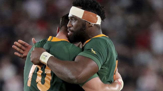 South Africa's captain Siya Kolisi, right, hugs teammate Handre Pollard after their World Cup final win. Picture: AP