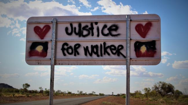 Signs on the Tanami Road to Yuendumu. Kumanjayi Walker. Zach Rolfe. Police shooting. Justice. Picture: Jason Walls