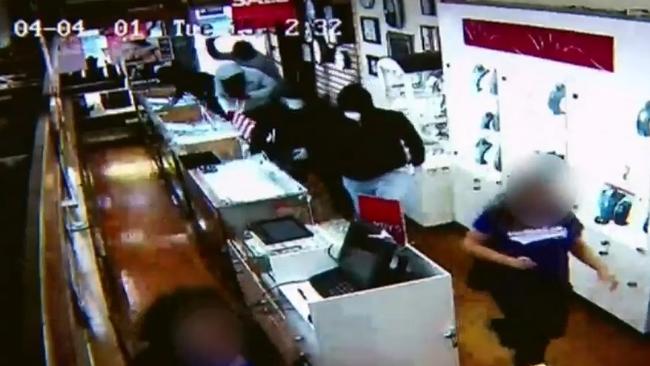 A group of masked robbers fill the Elsternwick store, snatching jewellery. Picture: Channel 9.