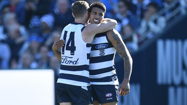 Tim Kelly and Joel Selwood celebrate a goal.