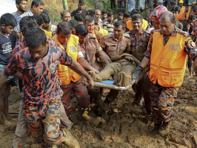 Rescuers carry the dead body of a victim after Tuesday's massive landslide in Rangamati district, Bangladesh. Picture: AP Photo