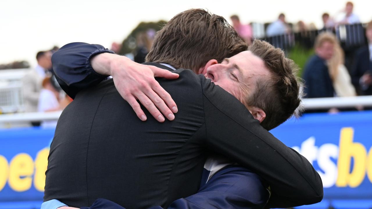 Coffey hugs assistant trainer Jack Turnbull. Picture: Vince Caligiuri/Getty Images