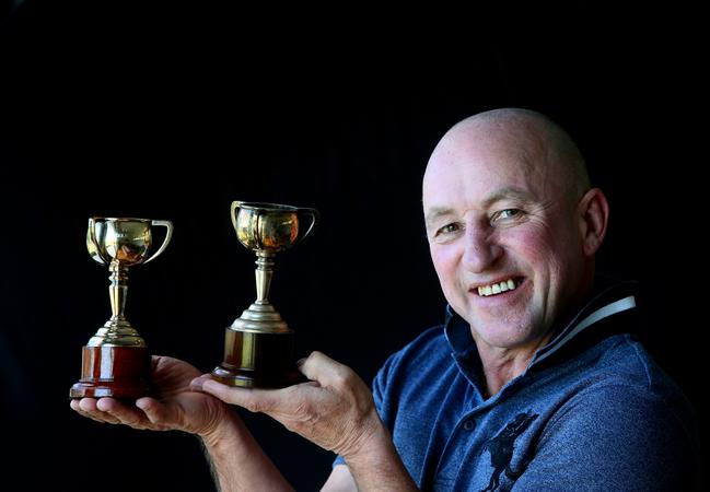 Jim Cassidy with his miniature Melbourne Cup jockey trophies. Picture: Sue Graham