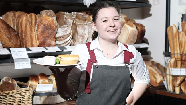 Jackman &amp; McRoss staff member Katie Webb with a King Island lamb and rosemary pie. Picture: LUKE BOWDEN