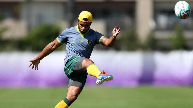 Will Genia kicks during a training drill. Picture: Getty Images