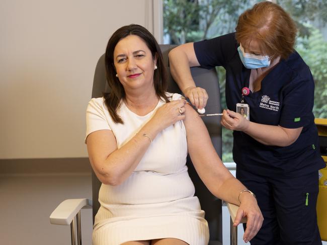 BRISBANE AUSTRALIA - NewsWire Photos JUNE 7, 2021: Queensland Premier Annastacia Palaszczuk is given the her COVID-19 vaccination by clinical nurse Dawn Pedder at the Surgical Treatment Rehabilitation Service Centre in Brisbane. NCA NewsWire / Sarah Marshall