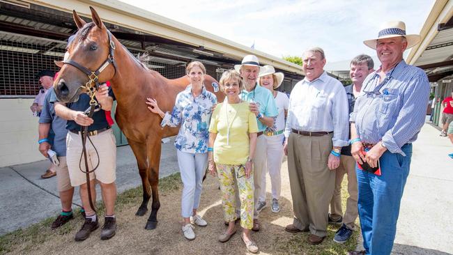The horse that sold for $2million at the Magic Millions with new owners and trainer Gai Waterhouse (back centre). Picture by Luke Marsden.