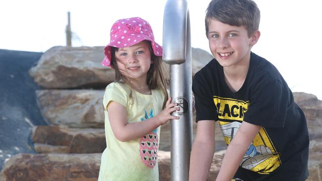 Young friends try a new water feature at the upgraded Jubilee Park. Picture: Emma Brasier