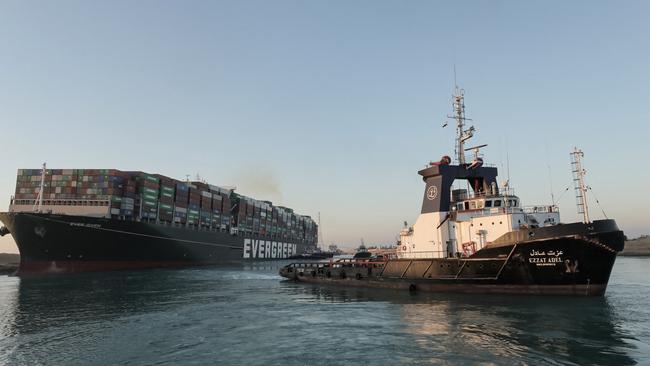 Tugboats pulling the Panama-flagged MV Ever Given. Picture: Suez Canal Authority/AFP