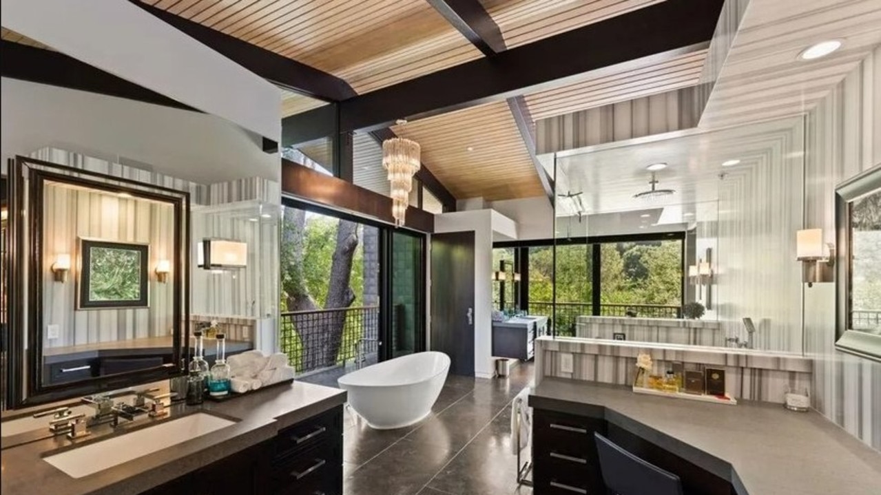 There’s a sculptural tub and dual vanities in the main bathroom. Picture: Realtor