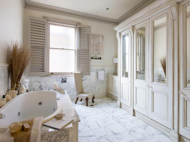 Calcutta marble bathrooms with heated floors adorn the second level.