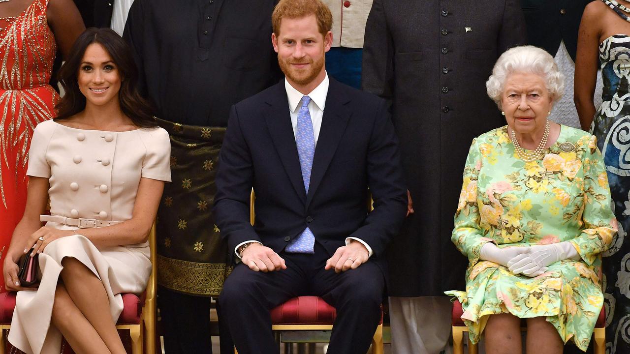 Meghan, Prince Harry and the Queen in 2018. Picture: John Stillwell / AFP