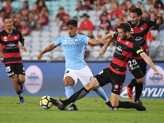 Robbie Cornthwaite tackles Daniel Arzani of Melbourne City. Picture: AAP