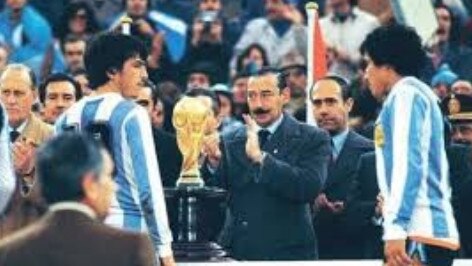 General Jorge Rafael Videla presents the World Cup to the Argentina football team in 1978.