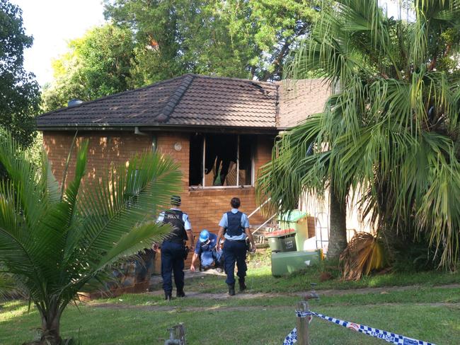 Police at the scene of the fire at Kincumber. Picture: Richard Noone