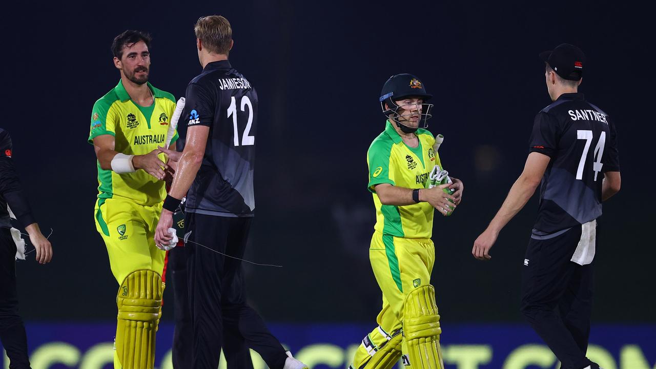 Mitchell Starc and Josh Inglis shake hands with New Zealand players Kyle Jamieson and Mitchell Santner after their warm-up match for the T20 World Cup. Picture: Getty Images