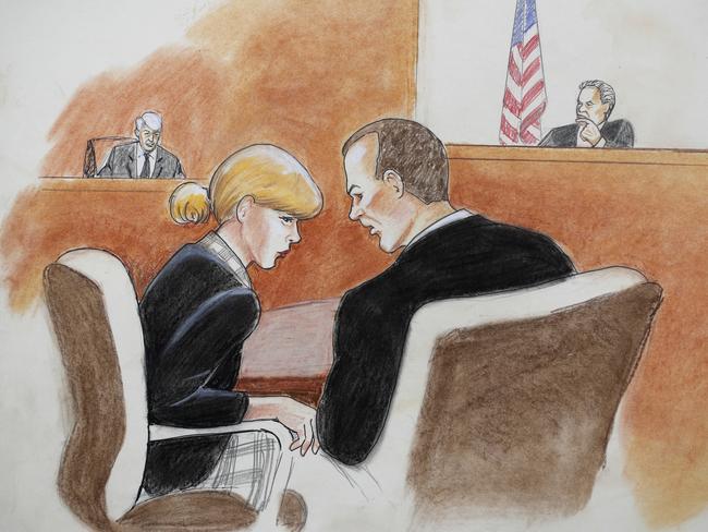 In this courtroom sketch, pop singer Taylor Swift, front left, confers with her lawyer as David Mueller, back left, and the judge look on. Picture: Jeff Kandyba via AP