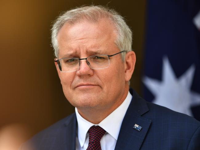 CANBERRA, AUSTRALIA - NOVEMBER 13:  Prime Minister Scott Morrison holds a news conference in the prime minister's courtyard on November 13, 2020 in Canberra, Australia. Morrison urged the national cabinet to reopen all of AustraliaÃ¢â¬â¢s state borders by Christmas as Covid-19 cases plummet, with only 12 newly diagnosed cases and 81 active cases nationally as of November 12. Additionally Victoria has achieved 14 consecutive days of no new cases being reported. (Photo by Sam Mooy/Getty Images)