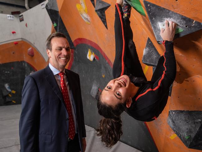 SYDNEY, AUSTRALIA - September 19: Stephen Conroy (CEO of JLL) posing for a portrait with Angie Scarth-Johnson whilst she is bouldering. JLL have provided Scarth-Johnson with a motion-capture climbing suit which analyses her climbing movements to help with her training. (Photo by James Gourley/The Australian)