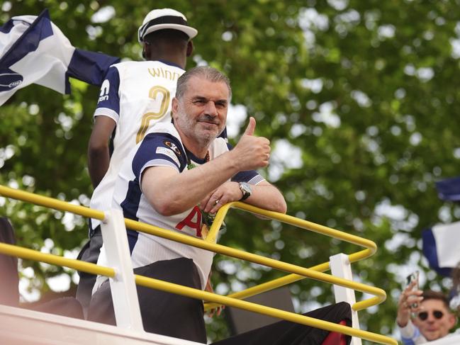 Ange Postecoglou on the open-top team bus during the Europa League winners parade in North London. Picture: AP