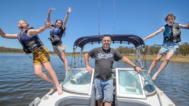 South Morang’s Darin Compt with his kids Brandon, Jessica and Ryan at Lake Eppalock after restrictions lifted. Picture: Jay Town