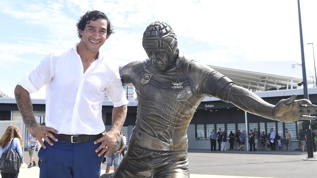 Johnathan Thurston poses with his bronze statue during its unveliling at Queensland Country Bank Stadium on February 21, 2020 in Townsville. Picture: Getty