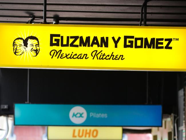 SYDNEY, AUSTRALIA - Newswire Photos JULY 26, 2021: A menulog delivery rider is seen picking up an order at the Mexican Food Chain Guzman Y Gomez during the COVID-19 lockdown in Sydney. Picture: NCA Newswire /Gaye Gerard