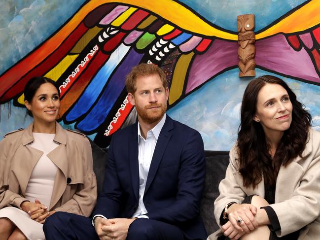 Britain's Prince Harry and Meghan, Duchess of Sussex and New Zealand Prime Minister Jacinda Ardern attend Pillars, a charity operating across New Zealand that supports children who have a parent in prison by providing special mentoring schemes in Auckland, New Zealand, Tuesday, Oct. 30, 2018. Prince Harry and his wife Meghan are on day 15 of their 16-day tour of Australia and the South Pacific. (AP Photo/Kirsty Wigglesworth,Pool)