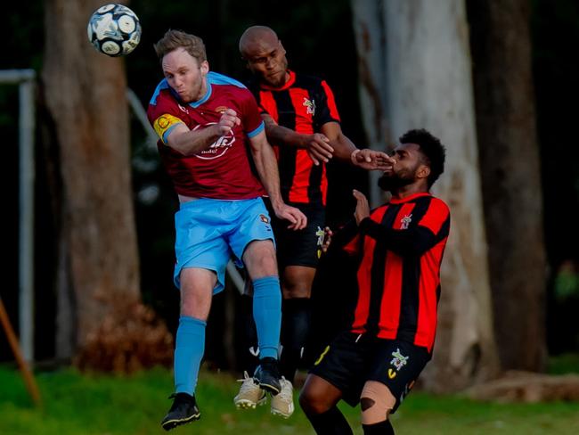 St Albans Captain Dominick Woodland and Gattonâs Fred Farui challenge for a header. Picture: DSL Photography