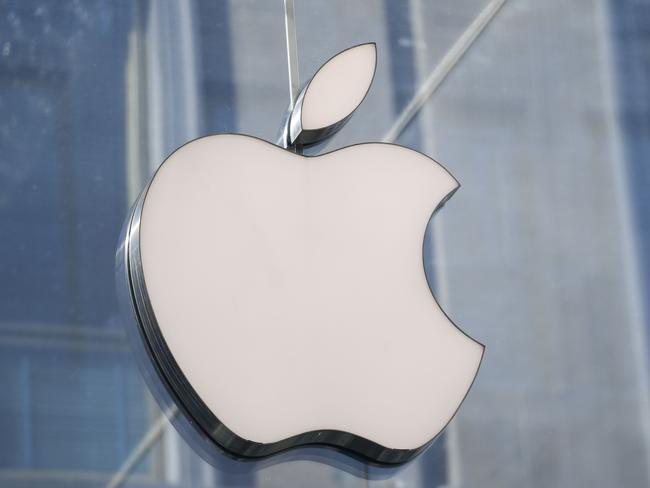 (FILES) This file photo shows a picture taken in center Milan on May 30, 2019 of the logo of American multinational company Apple. - Apple is making environmental and social values factors it will weigh when calculating bonuses for top executives, according to a regulatory filing on January 5. The change taking effect this year is intended to motivate Apple executives "to meet exceptionally high standards of values-driven leadership in addition to delivering strong financial results," the Silicon Valley technology titan said in proxy documents filed with the Securities and Exchange Commission. (Photo by Miguel MEDINA / AFP)