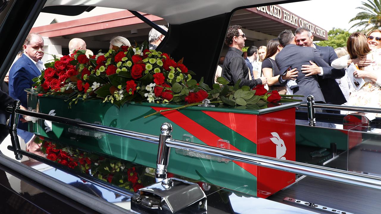 Sattler’s casket was varnished in red and green, with a matching spray of flowers on top. Picture: NCA NewsWire/Tertius Pickard