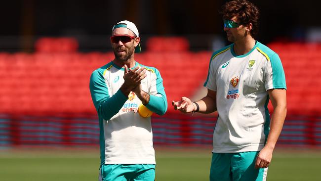 Glenn Maxwell (left) and Tim David during an Australia T20 International Squad Training Session at Metricon Stadium. photo: Getty Images