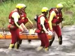 , Crews from Burleigh Heads and Nerang Fire and Rescue stations were called to assist our mates at Queensland Ambulance Service (QAS) to access a patient cut off by localised flooding in Tallebudgera Valley., Thanks to the help from our swiftwater rescue technicians, the patient was carried over a flooded roadway to the safety of paramedics. The Tallebudgera Valley Rural Fire Brigade was also there, using their local knowledge to transport QAS to the patient’s location Picture QFRS