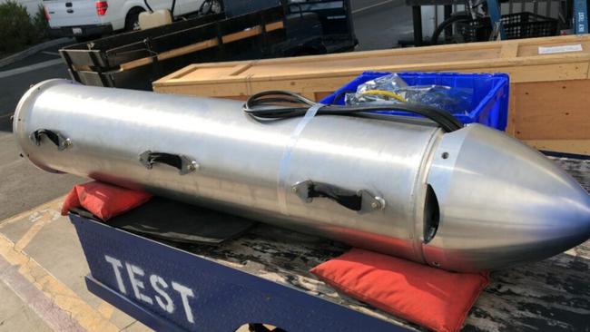 Musk posted footage of the submarine-like cylinder being pulled by hand by divers.