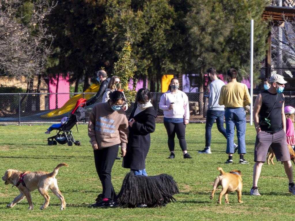 Melburnians enjoy the sunshine for their one hour of daily exercise on Saturday prompting concerns about people not heeding the stage-four restriction measures. Picture: Wayne Taylor