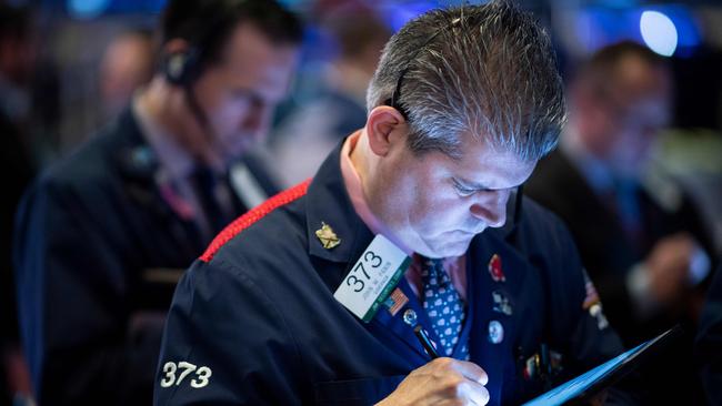 Traders work at the New York Stock Exchange. Photo: AFP