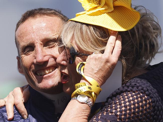 MELBOURNE, AUSTRALIA - NOVEMBER 07: Damien Oliver is hugged by a representative of Alenquer before Race 7, the Lexus Melbourne Cup, during Melbourne Cup Day at Flemington Racecourse on November 07, 2023 in Melbourne, Australia. (Photo by Daniel Pockett/Getty Images)