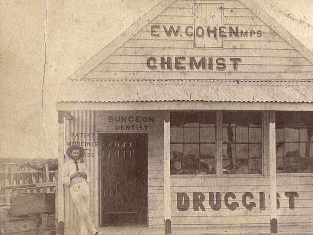 Chemist and druggist, E. W. Cohen. at Arrilalah in 1884 in front of his store. (Photo: State Library of Queensland)