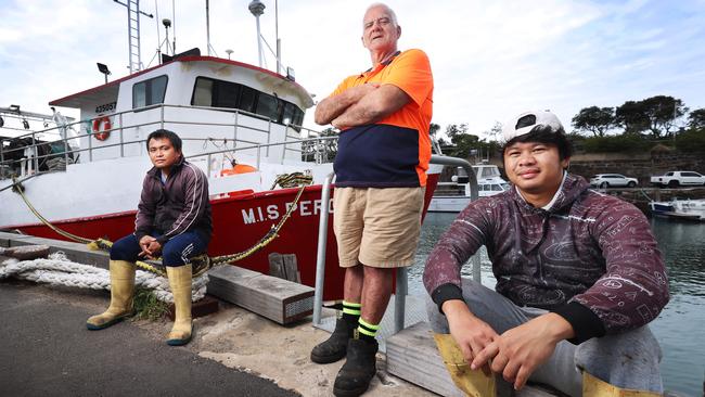 Trawler skipper Phillip Lagana, centre, with crewmen John and Colin, in Wollongong Harbour. Picture: John Feder