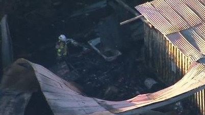 Firefighters at the scene of the deadly blaze on Saturday morning. Picture: 9 News