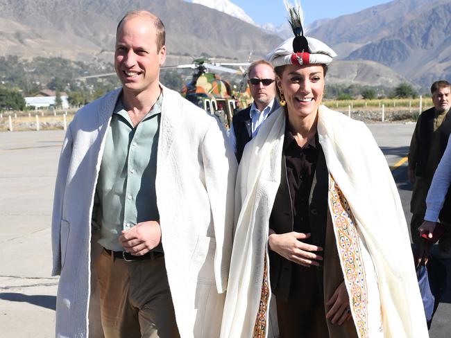 The Duke and Duchess of Cambridge are welcomed as they arrive by helicopter in Chitral, Pakistan.