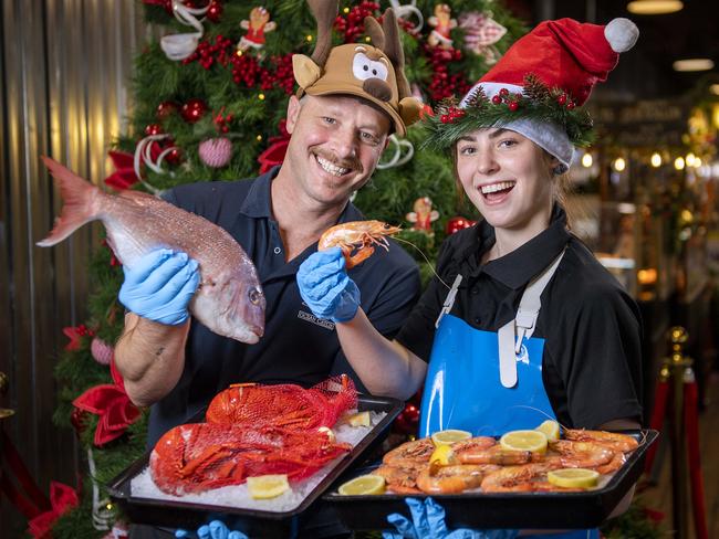 Sean Lawrence manager of Angelakis Seafood at the Central Markets who has worked their for 25years with his daughter Kaylee ,19, who has worked there for fives years with crayfish and prawns at Angelakis Seafood at the Adelaide Central Market .Thursday,December,19,2024.Picture Mark Brake