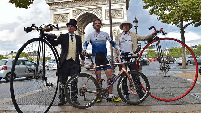 Mark Beaumont with the men who accompanied him into Paris on penny-farthings. Picture: AFP/Christophe Archambault